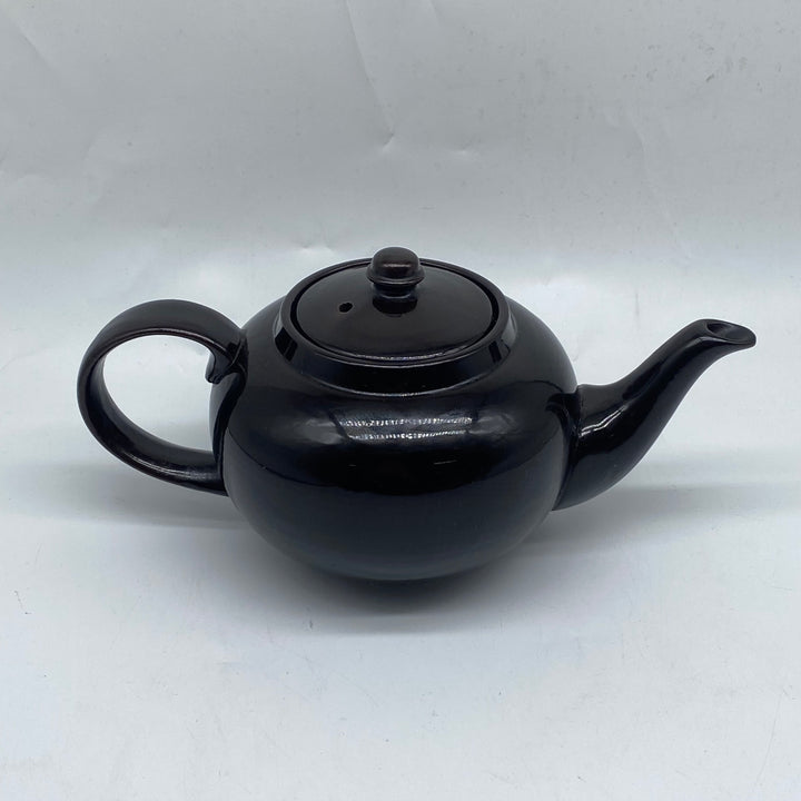 Elegant svart tekanna i keramik