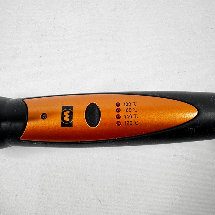 Kompakt hårfön i svart och orange design